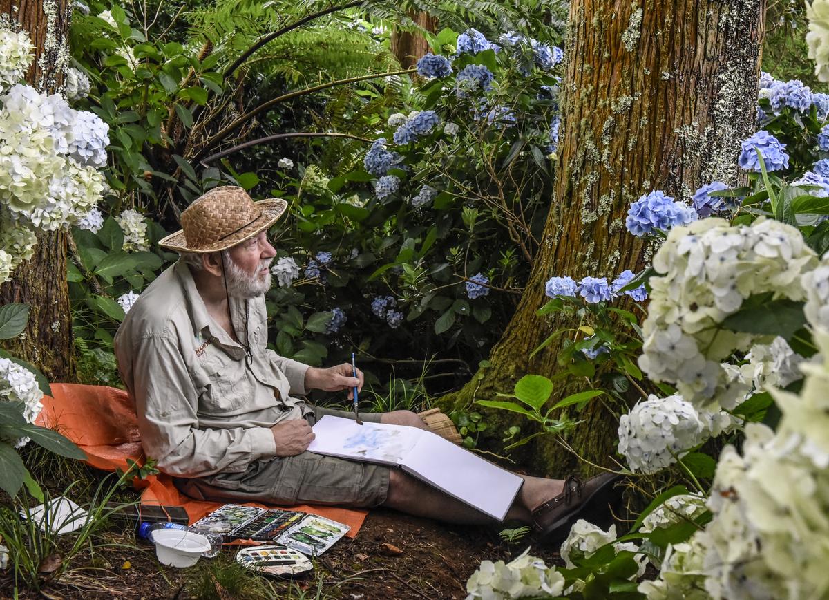 Artist Pieter Adriaans painting in his garden on São Jorge, Azores. Photo by Jorge Blayer Gois.